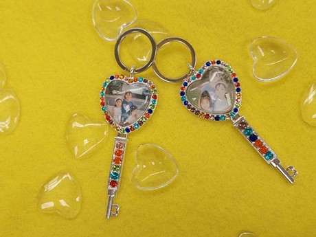 two cabochan keyrings on a felt mat.