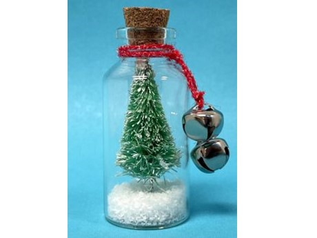 Christmas tree in a glass bottle with snow