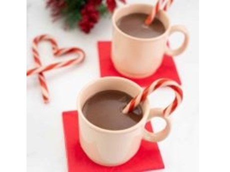 Two cups of hot cocoa with some candy canes