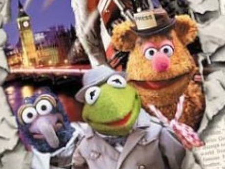 Gonzo. Kermit, and Fozzie, dressed as reporters, jumping out of a torn newspaper.