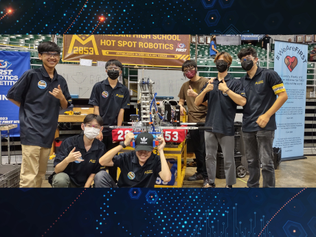 Mililani High School robotics team in front of a robot