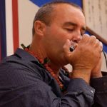Danilo Marrone playing the harmonica