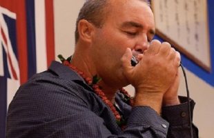 Danilo Marrone playing the harmonica
