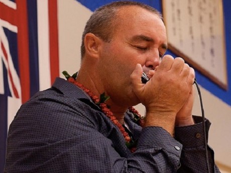 Danilo Marrone playing the harmonica