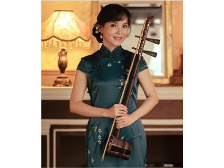 Dr. Sun Hui, a Chinese musician holding stringed instrument called an erhu