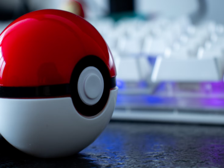 pokeball from pokemon next to a keyboard