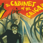 Top half of the movie poster for the 1919 silent film, "The Cabinet of Dr. Caligari." The title of the movie is in yellow over a red field. Underneath is an old-fashioned lamp post, and the gaunt figure of a vampire.