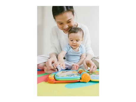 Mother reading with young child