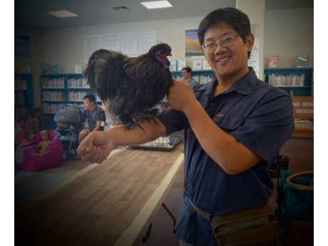 Man holding rooster