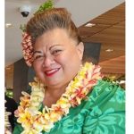 Hawaiian woman with lei and green dress