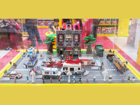 city built from legos, yellow banners