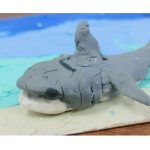 Clay grey shark on blue clay ocean