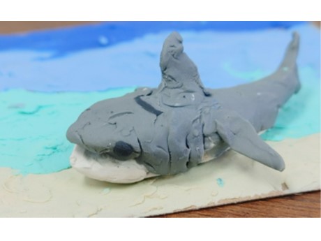 Clay grey shark on blue clay ocean