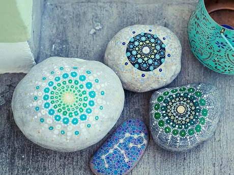 Rocks painted with colorful designs