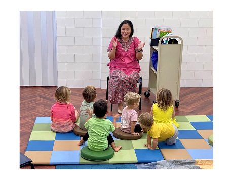 Librarian and children at storytime program