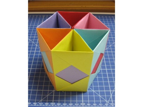 rainbow colored hexagonal paper and cardboard pen holder