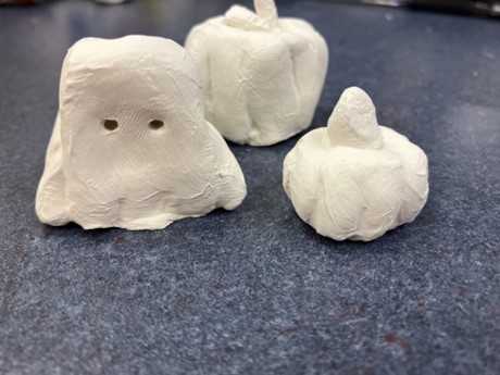 ghost and pumpkins made of clay