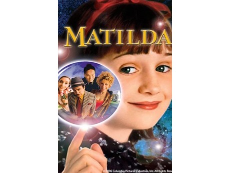 Movie poster featuring main character Matilda, smiling little girl with dark hair and a red headband