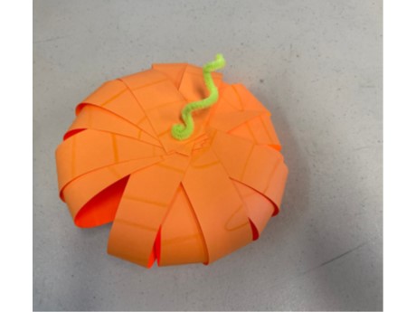 Orange pumpkin made from paper strips