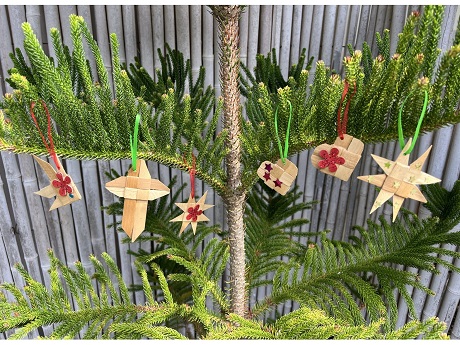 Lauhala ornaments on christmas tree.