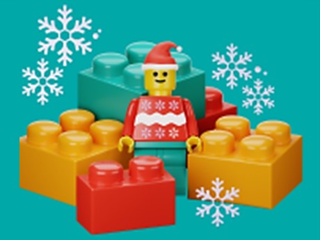 LEGO figure in winter attire background of LEGO blocks and snowflakes