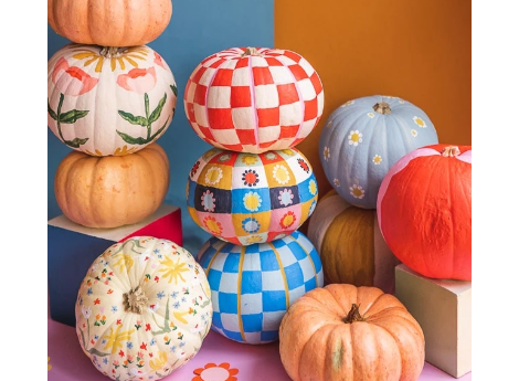 Small pumpkins, painted in bright colors and designs.