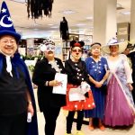Costumed singers from Sing For Your Life group pose for a photo