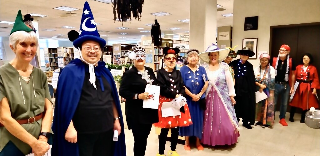 Costumed singers from Sing For Your Life group pose for a photo