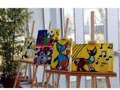 painted canvases on easels