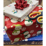 wrapped presents with bow and scissors