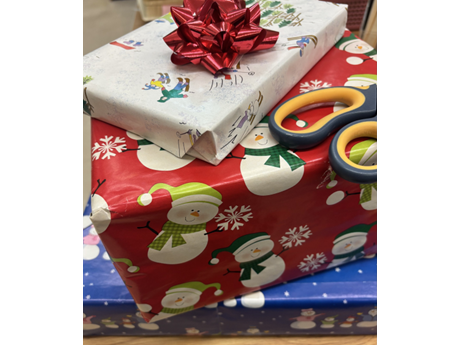 wrapped presents with bow and scissors