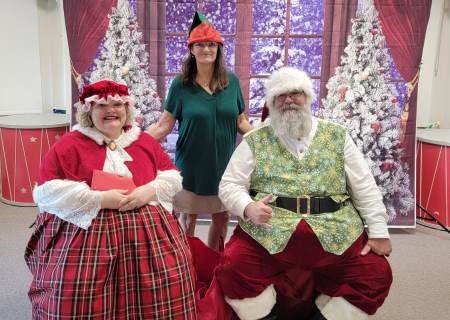 Picture of Mr. and Mrs Claus with an elf