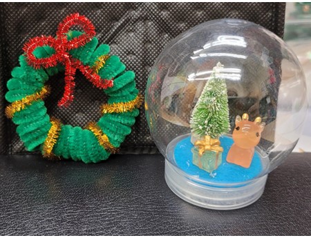Holiday craft of wreath and snow globe