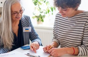 A female volunteer assisting a female applicant