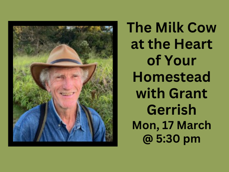 A man in a hat in a pasture.