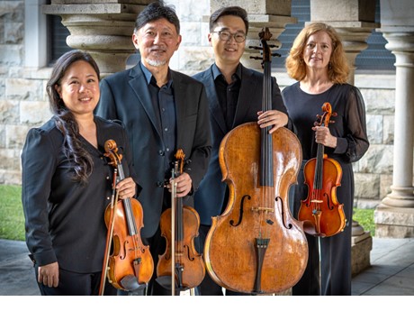 A group of people holding instruments