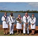 A photo of a woodwind quintet- five individuals dressed in uniform and holding their musical instruments.