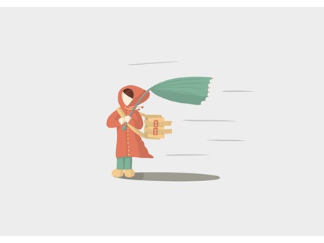 Person in orange raincoat holding a green umbrella blown inside-out by the wind