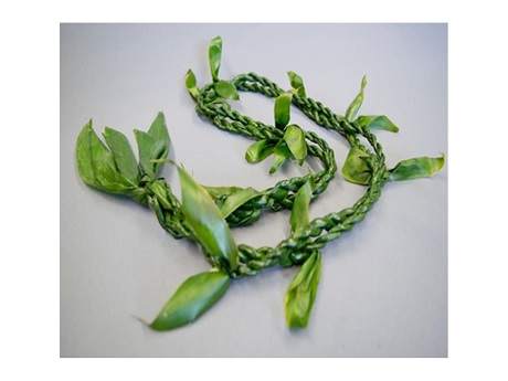 Color photo of hili-style ti-leaf lei