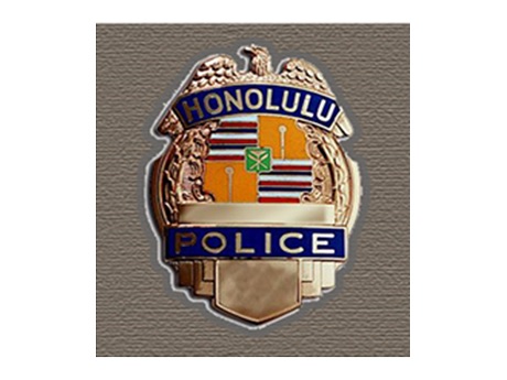 Color photo of a Honolulu Police Department officer's badge
