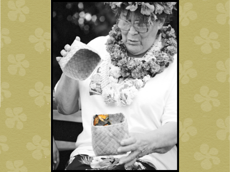 Nona Beamer holding a lauhala basket with a butterfly