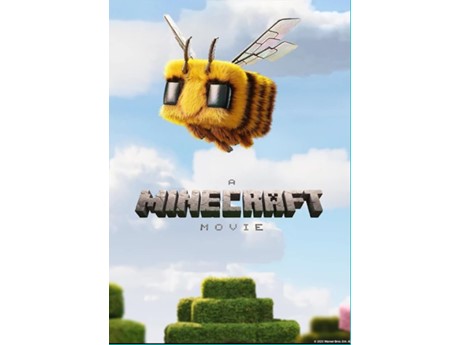 Bee flying over green hedges