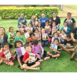 Picture of children and families with books