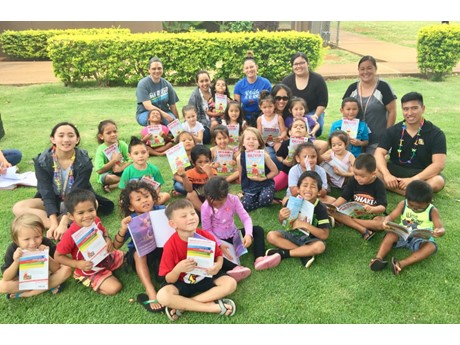 Picture of children and families with books