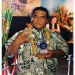 man holding award