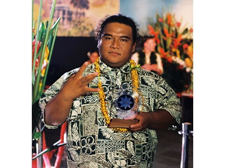 man holding award