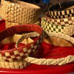 Tan bracelets woven from the lauhala plant.