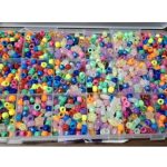 a box of colorful plastic beads