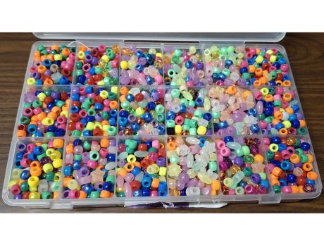 a box of colorful plastic beads