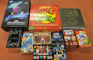 Assorted table top games including Apples to Apples, Fluxx, Sushi Go and more.